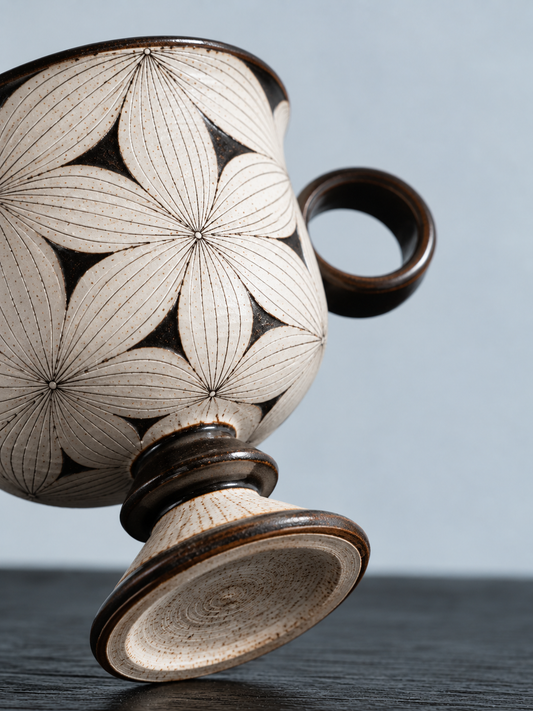All-Over Floral goblet mug — carved petal and pedestal detail